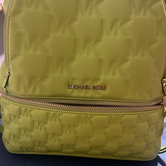 Gently used in excellent condition Michael Kors neon green back pack purse. - Picture 5 of 8